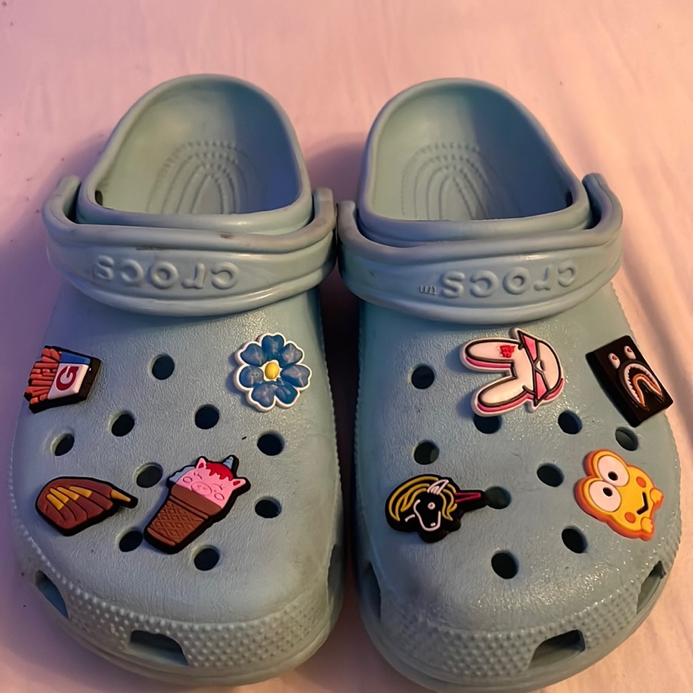 teal crocs with charms